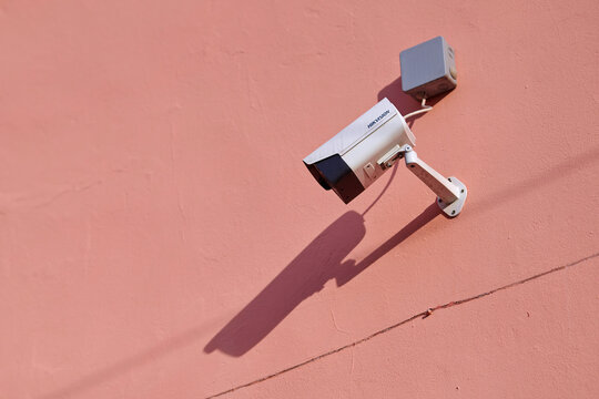 Minsk,Belarus. Apr 2021. Hikvision CCTV camera, video surveillance cam mounted on building wall. Hikvision - Chinese manufacturer and largest supplier of video surveillance products in the world