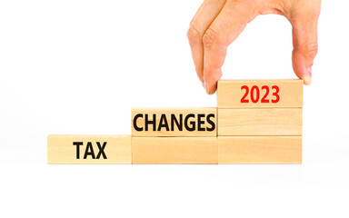Tax changes 2023 symbol. Concept words Tax changes 2023 on wooden blocks on a beautiful white table...