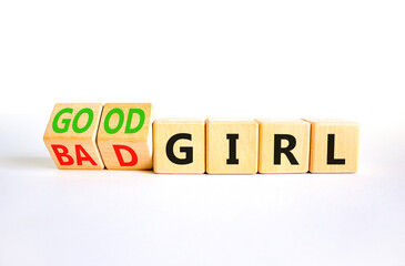 Good or bad girl symbol. Concept word Good girl Bad girl on wooden cubes. Beautiful white table white background. Business psychological good or bad girl concept. Copy space.