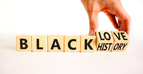 Black history and love symbol. Concept words Black history Black love on wooden cubes. Businessman hand. Beautiful white table white background. Black history and love concept. Copy space.