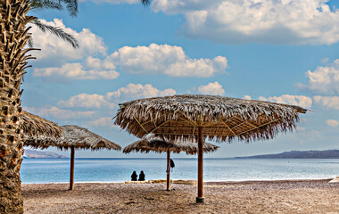 Early morning on sandy beach at the Red Sea near Eilat - famous tourist resort and recreation city in Israel

