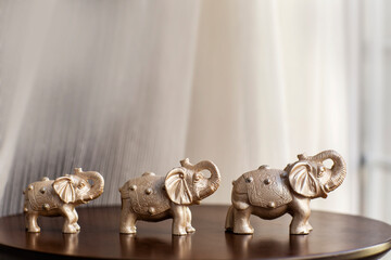 Tree elephants on the table 