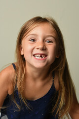 young girl with one missing tooth