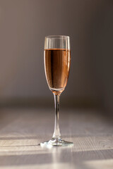 glass of pink wine vertical 