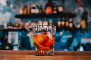Cocktail Negroni with gin, campari martini rosso and orange. negroni cocktail at the bar