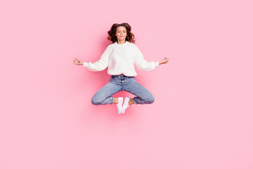 Full length photo of dreamy pretty woman dressed white pullover enjoying yoga jumping high isolated...