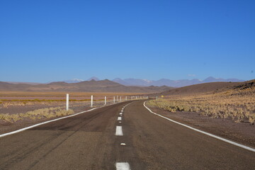 Fototapeta na wymiar Lonely road curve desert bokeh chile South America