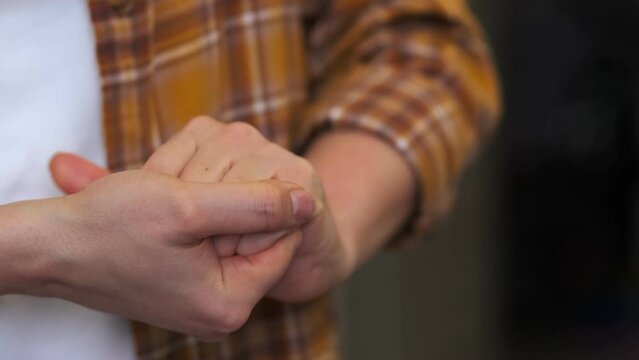 woman itches and moves her hands anxiously. an irritable woman. anxiety disorder symptoms concept.