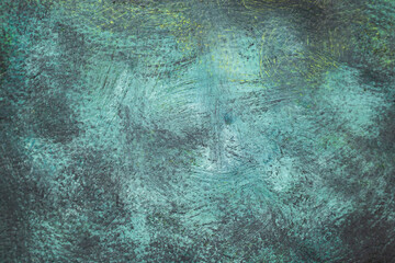 Dark green paint smudged on leather texture, with vignette