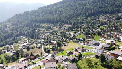 Swiss Alps in Sion region, aerial footage taken by a drone during warm summer time, clear blue skies and beautiful mountain scenery