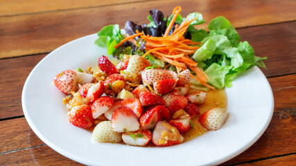 Close up of fresh strawberry spicy salad.
