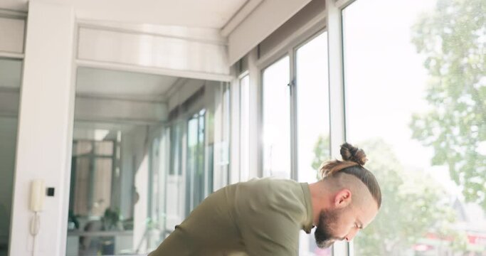 Creative businessman, angry and throwing phone in frustration after reading bad news at the office. Upset, aggressive male employee walking in hallway smashing smartphone in anger for failed startup