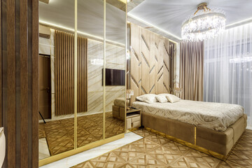 Luxury bedroom interior with parquet and mirror walls