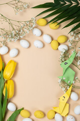 Happy Easter - layout with space for text center, Easter bunnies made of origami paper and eggs, top view