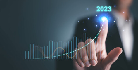 Growth and development chart of company in new year 2023. Planning, long term investment, opportunity, challenge and business strategy in new year 2023. Development to success and motivation.