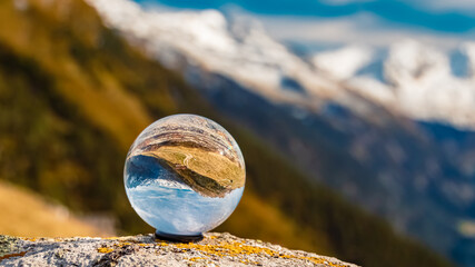 Crystal ball alpine evening landscape shot at the famous Ahorn summit, Mayrhofen, Zillertal valley, Tyrol, Austria