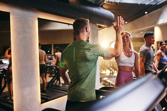 People high-fiving after a running class