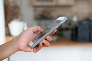 Close up hand of technology in use .  Man working in coffee cafe hand smart phone.. Concept of using technology in communication.