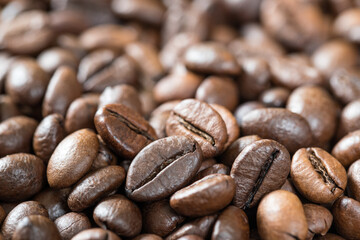 Close-up of roasted coffee beans, background, texture. Good mood. Coffee aroma. Selective focus
