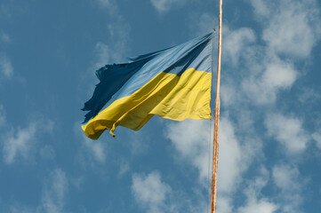 ukrainian flag on blue sky