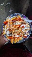 Pasta with tomato sauce, chicken, and tomatoes.