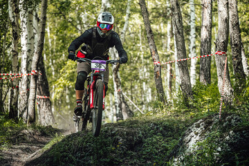 athlete rider downhill forest trail race