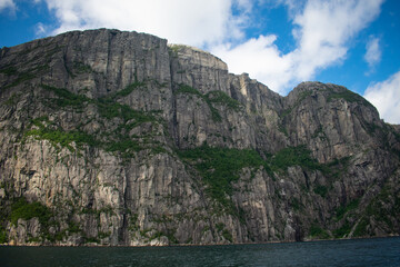 Stavanger Norway Fjord Coastline seen from offshore boat on cloudy summer day 