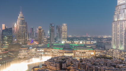 Aerial view of Dubai International Financial Centre district day to night