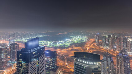 Fototapeta na wymiar Panorama of Dubai Marina with JLT skyscrapers and golf course night , Dubai, United Arab Emirates.
