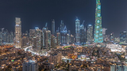 Fototapeta na wymiar Dubai Downtown night with tallest skyscraper and other towers