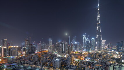 Fototapeta na wymiar Dubai Downtown all night with tallest skyscraper and other towers