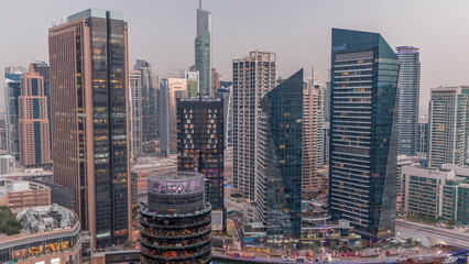 Fototapeta premium Dubai Marina Skyline with JLT district skyscrapers on a background aerial day to night .