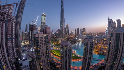 Fototapeta na wymiar Panorama of Dubai Downtown cityscape with tallest skyscrapers around aerial night to day .