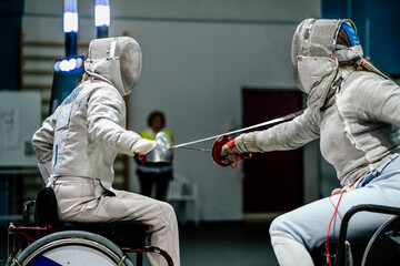 women fencer wheelchair fencing competition - obrazy, fototapety, plakaty