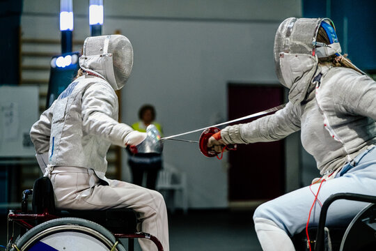 women fencer wheelchair fencing competition - Powered by Adobe