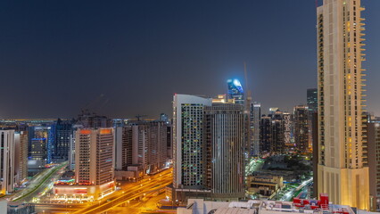 Fototapeta na wymiar Skyscrapers at the Business Bay in Dubai aerial day to night , United Arab Emirates
