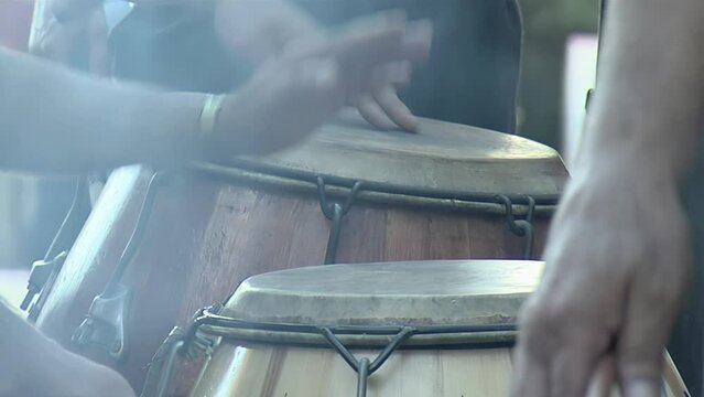 Men Playing Conga Drums during a Celebration on the Streets in Buenos Aires, Argentina. Close Up. 