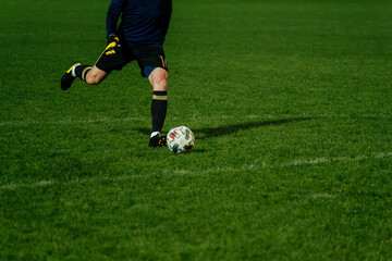 goalkeeper kick ball during football match