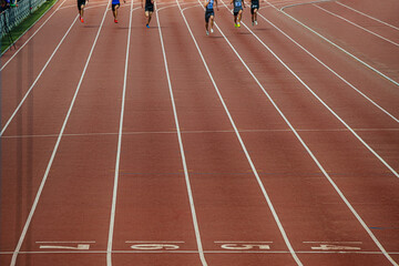 group athletes sprinters finish running at stadium