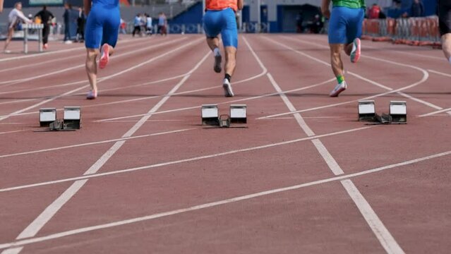 Chelyabinsk, Russia - June 5, 2022: start men athletes run 100 meters in UFD Athletics Championship