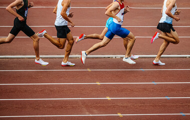 Fototapeta na wymiar group male athletes run middle distance race