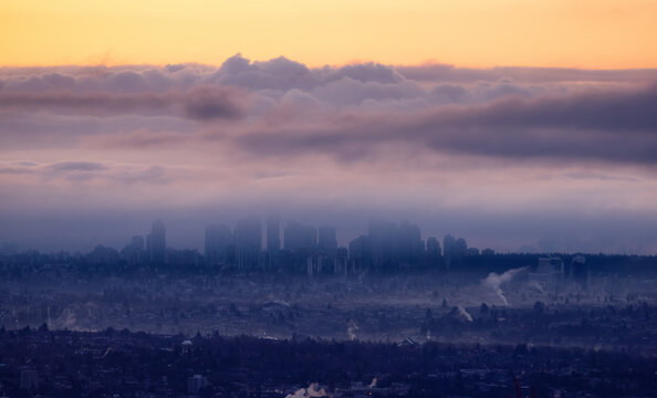 Metrotown City viewed from Cypress Lookout. Cloudy and Foggy Sunrise. Vancouver, British Columbia, Canada. © edb3_16