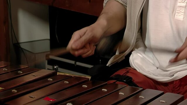 Xylophone Player, Musician Playing a Xylophone, Wooden Bars of a Xylophone Being Struck by Mallets. Close Up.