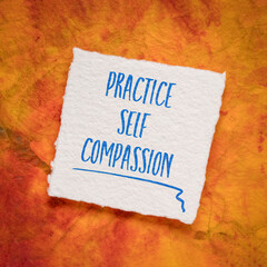 practice self-compassion inspirational handwriting on an art paper, mindset and personal development concept