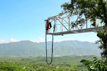 Fototapeta na wymiar Bungee jumping tower against beautiful mountain landscape