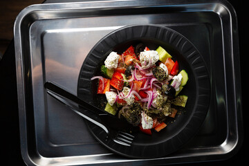 Greek salad on tray food top view