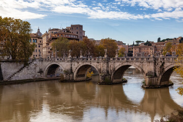 River Tiber and Bridge in a historic City, Rome, Italy. Sunny and Cloudy day.