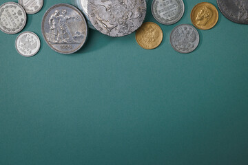 Numismatics. Old collectible coins on the table. Top view. Copy space for your text