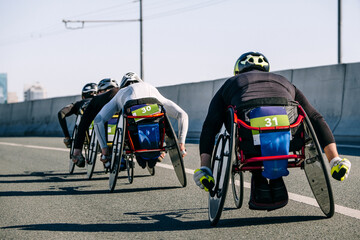 back group wheelchair athlete in marathon race