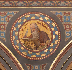 BERN, SWITZERLAND - JUNY 27, 2022: The fresco of St. Jerome in the church Dreifaltigkeitskirche by August Müller (1923).
